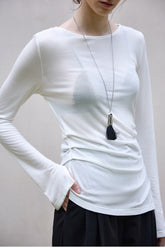 Stilvolles, figurbetontes Baselayer aus Wolle und Tencel mit asymmetrischem Saum