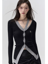 Elegante, lange schwarze Strickjacke mit Lochmuster