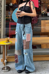 Vintage Jeans mit Farbspritzern und Rissen