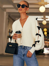 Schleifengerippter Strickmantel