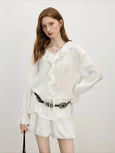 Elegante Bluse mit Rüschenärmeln und botanischem Muster