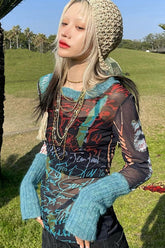 Bedruckte, schmal geschnittene Strickbluse mit Mesh-Einsätzen und langen Ärmeln