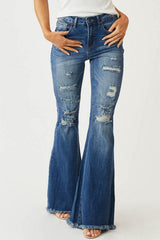 Schmal geschnittene, dehnbare Jeans mit mittelhohem Bund, Fransen und Vintage-Schlaghose