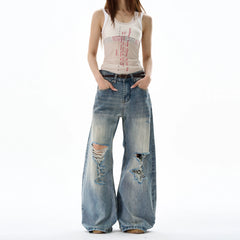 Schwere, kniebelastete, ausgefranste, weite blaue Jeans