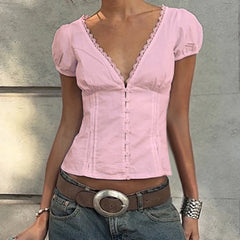 Bluse mit V-Ausschnitt und Spitzenapplikationen