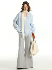 Herbstliches Set aus einfarbigem Pullover und Unterweste