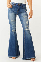 Schmal geschnittene, dehnbare Jeans mit mittelhohem Bund, Fransen und Vintage-Schlaghose