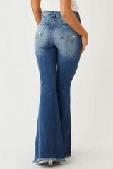 Schmal geschnittene, dehnbare Jeans mit mittelhohem Bund, Fransen und Vintage-Schlaghose